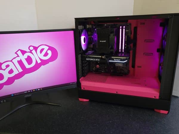 A custom-built PC with a pink theme, inspired by #BarbieTheMovie, showcasing top-tier components and style.